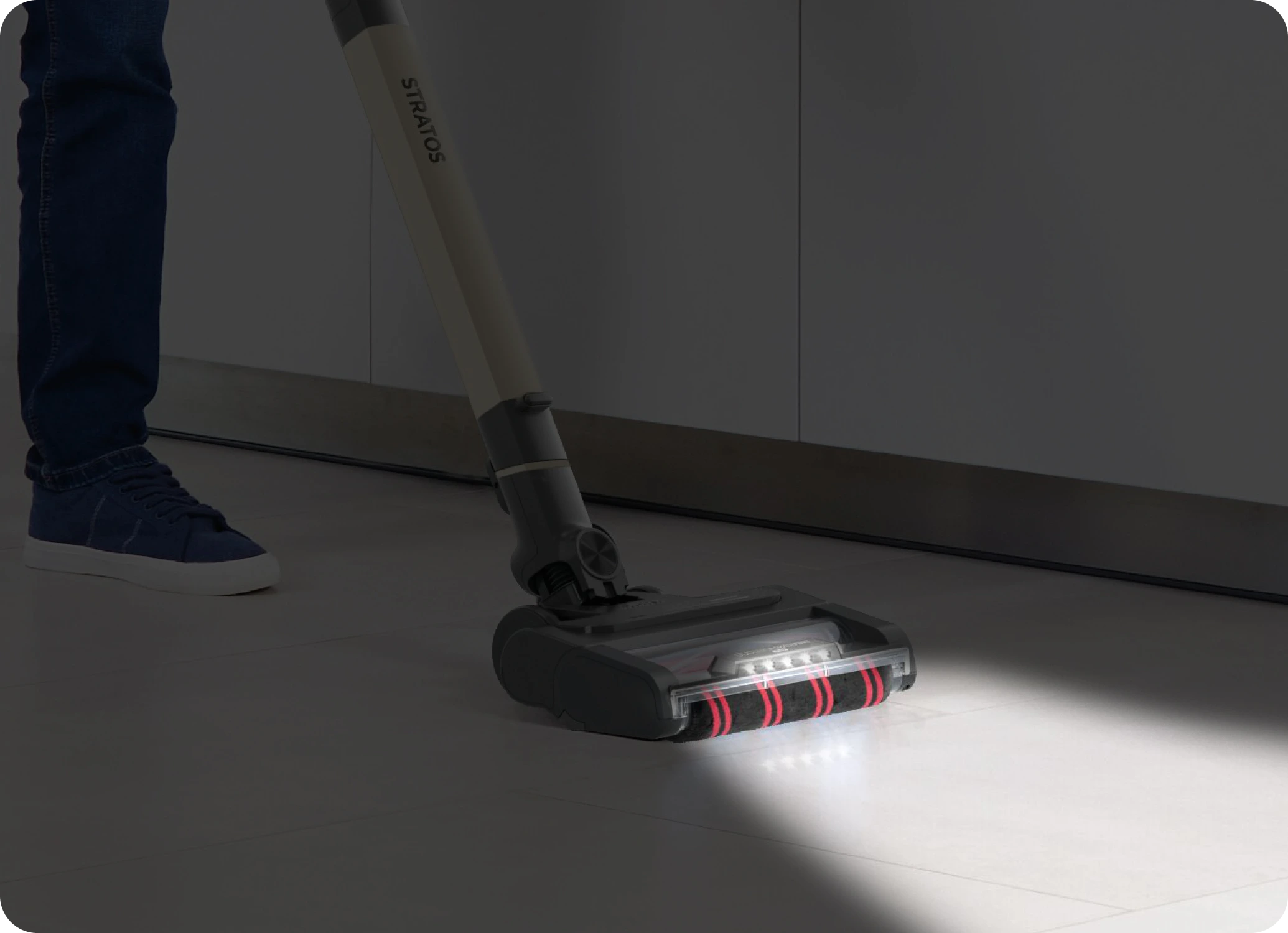 Man using vacuum in living room
