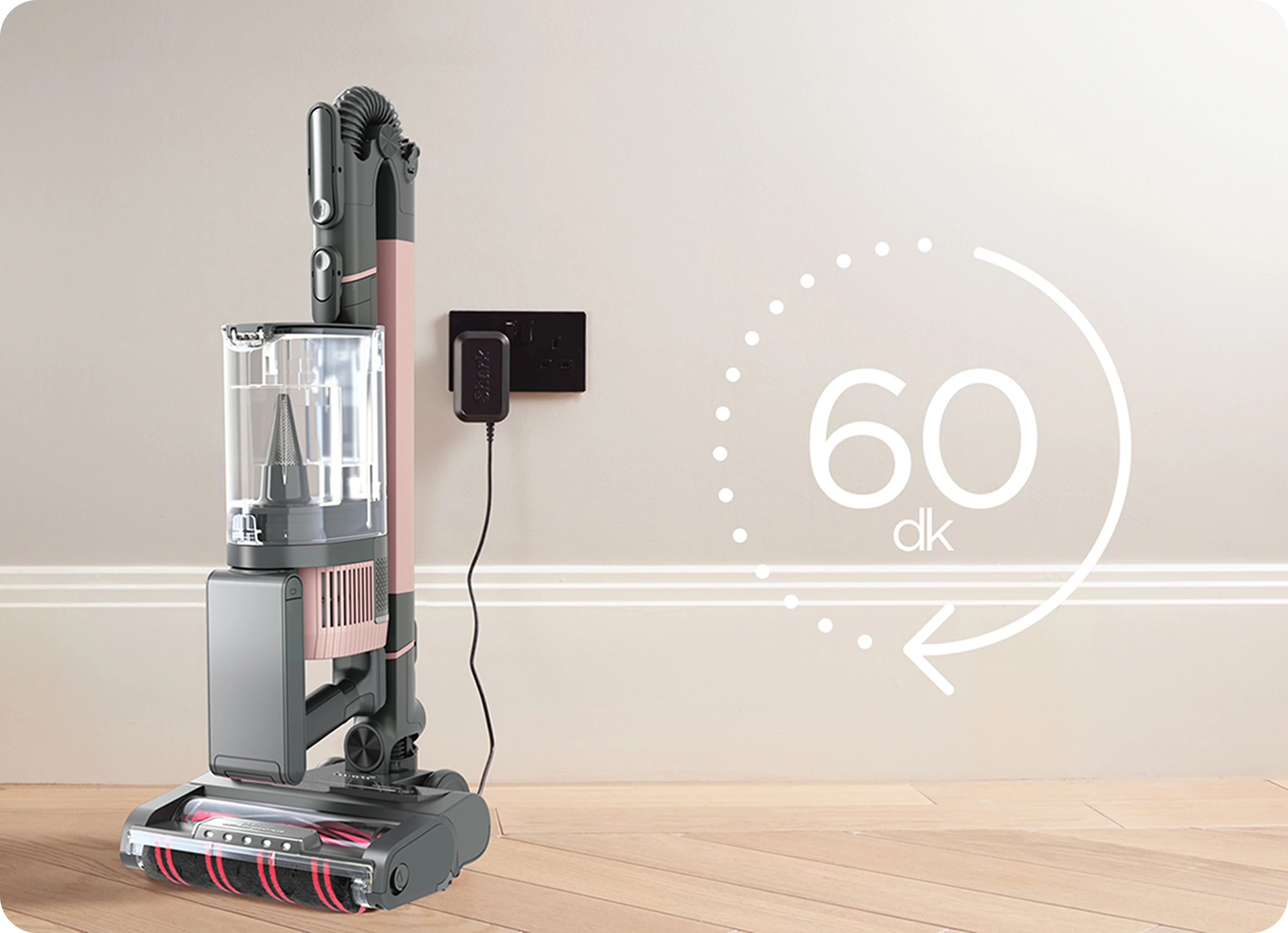 Woman using vacuum in kitchen