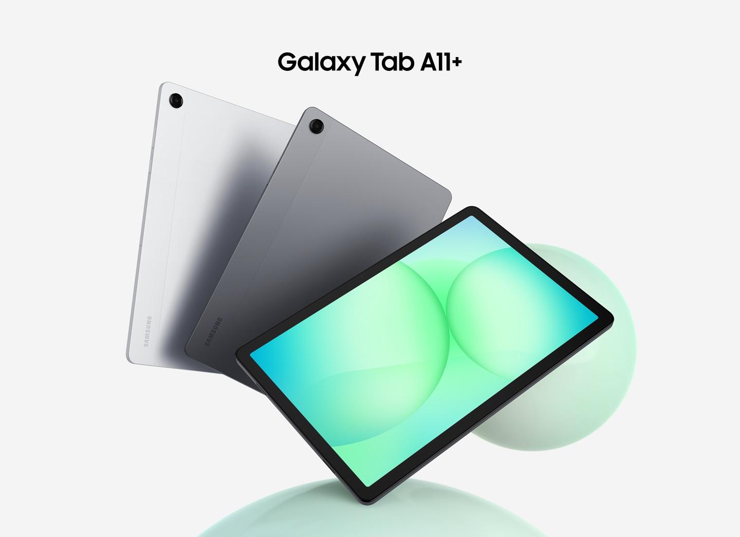 Three Galaxy Tab A11+ tablets are arranged in a fan layout. The first two on the left show their backs in silver and gray, while the front-facing tablet displays a greenish circular patterned graphic on its screen. Above the tablets, the text reads 'Galaxy Tab A11+'.