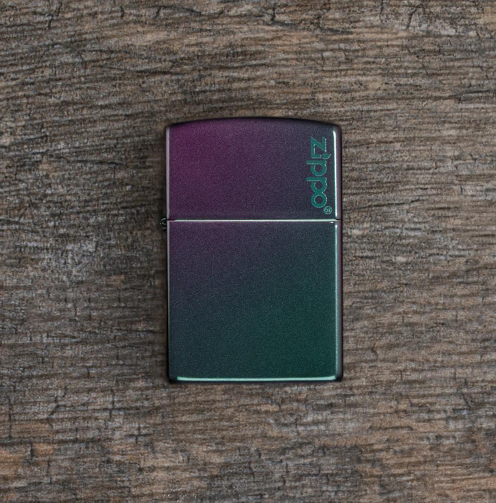 Iridescent Zippo Logo windproof lighter facing forward at a 3/4 angle