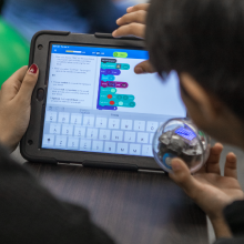 Teacher and student coding Sphero BOLT STEM robot on an ipad