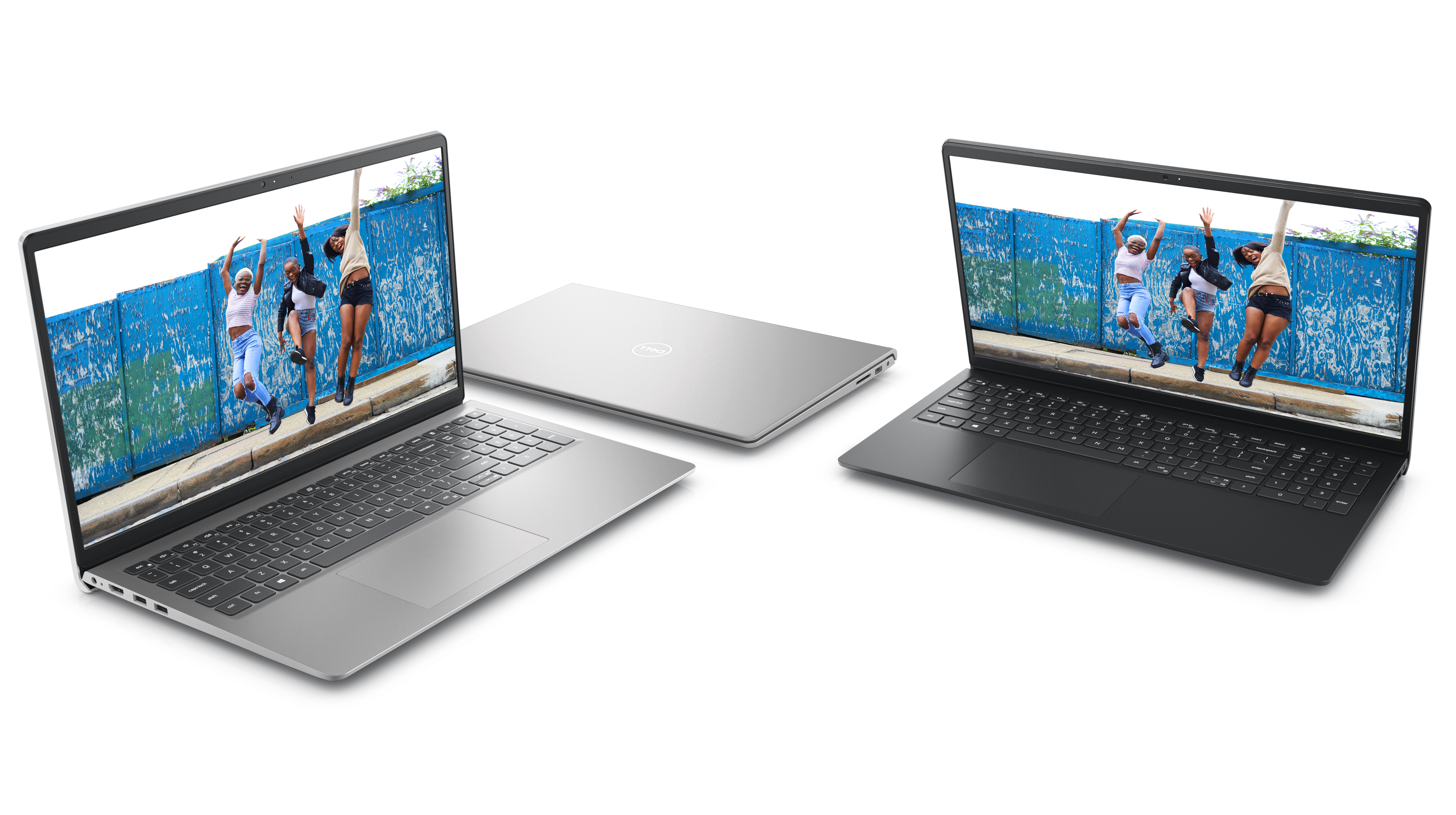 İkisi açık ve biri kapalı olmak üzere yan yana yerleştirilmiş üç Dell Inspiron 15 3520 Dizüstü Bilgisayarın resmi.