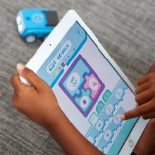 Kid using the free Sphero Edu Jr app to learn coding concepts.